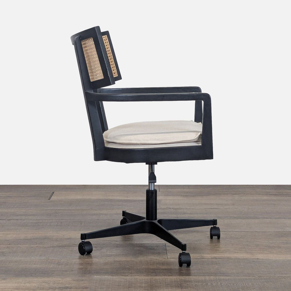 2. Side profile of the Libby desk chair highlighting its natural cane back, slim cushion, and adjustable height lever.