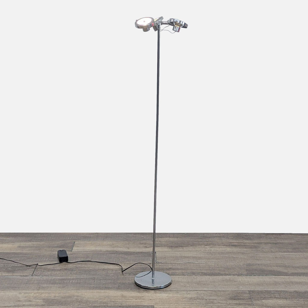 1. Chrome Ikea floor lamp with three adjustable spotlights on a slim pole, placed on a wooden floor.  
