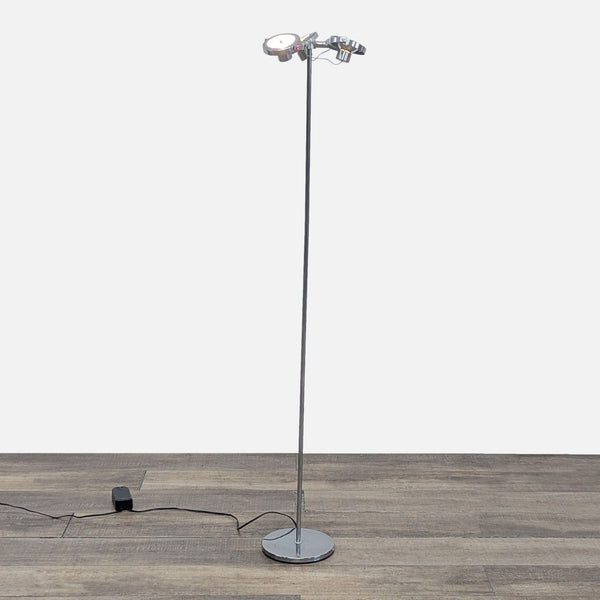 1. Chrome Ikea floor lamp with three adjustable spotlights on a slim pole, placed on a wooden floor.  