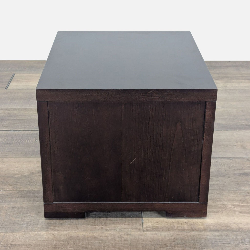3. Back view of Crate & Barrel dark wood end table, displaying a simple, flat-panel design.