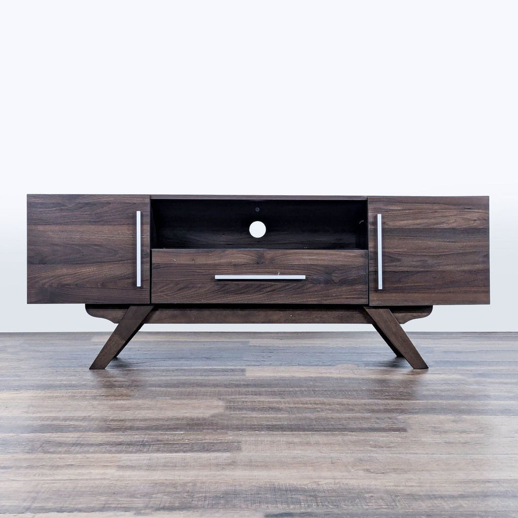 1. Reperch entertainment center with angled legs, central drawer, open shelf, and two side cabinets, in dark wood finish.