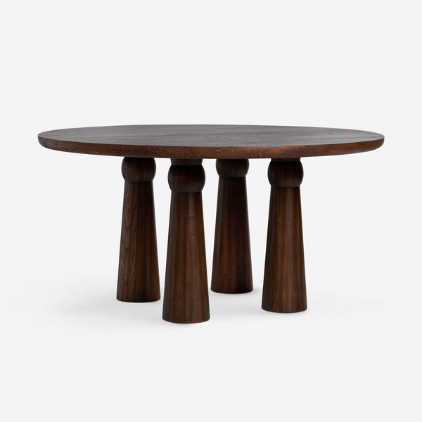 Round dining table by Lulu And Georgia in cocoa finish, Sungkai wood with removable, rounded tapered legs.  