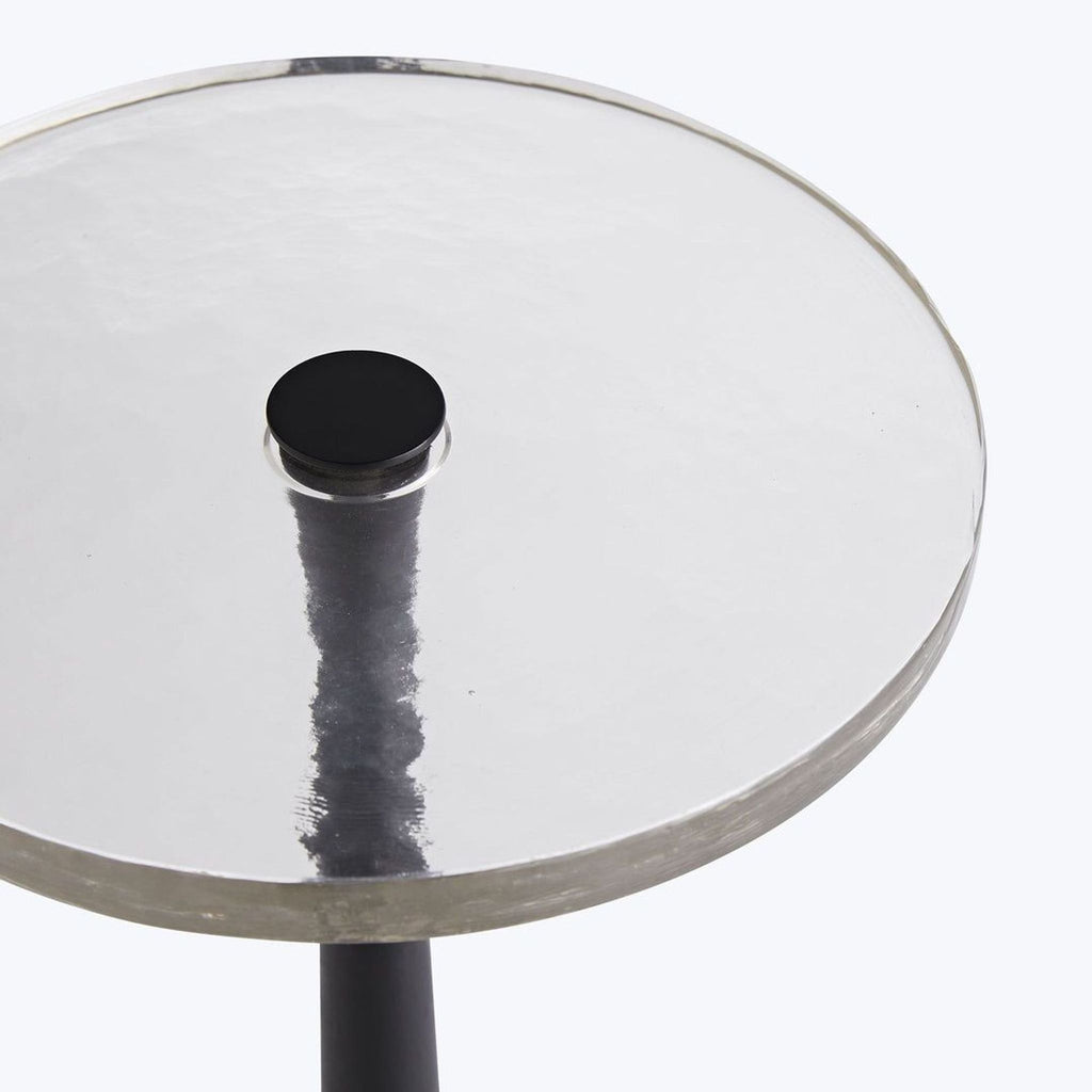 3. Detail of textured clear cast glass tabletop with central iron support from Arteriors Home side table.