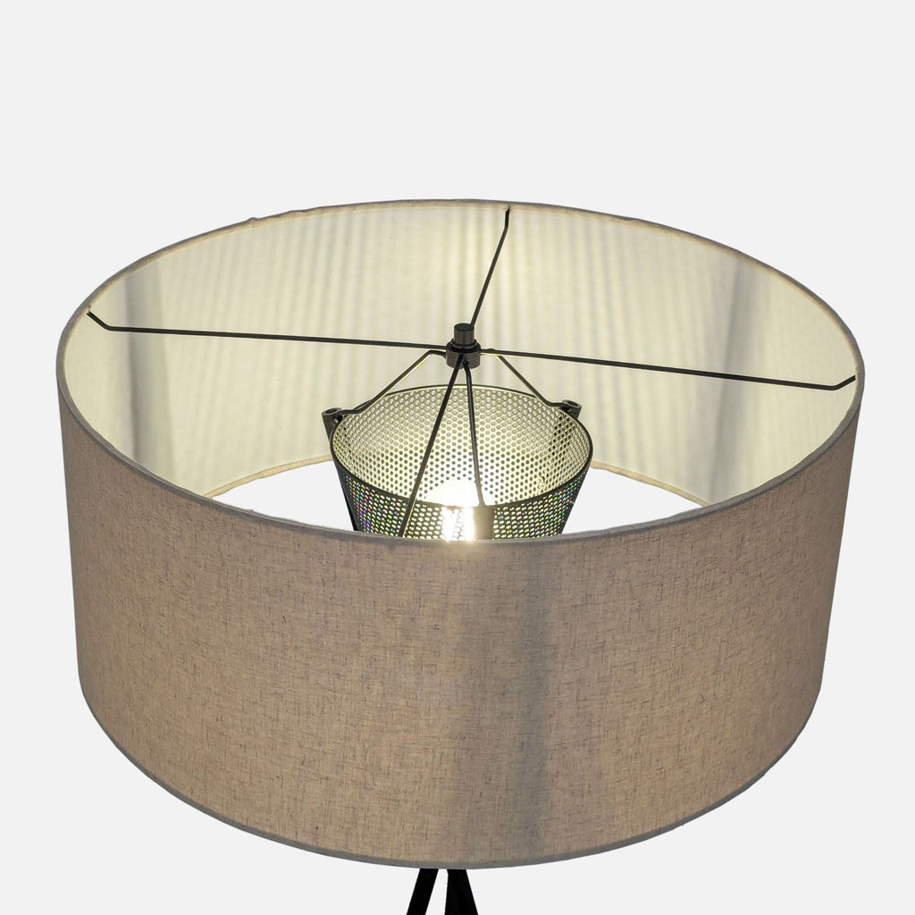 2. Top-down view of West Elm tripod floor lamp, showing perforated metal light diffuser inside beige drum shade.