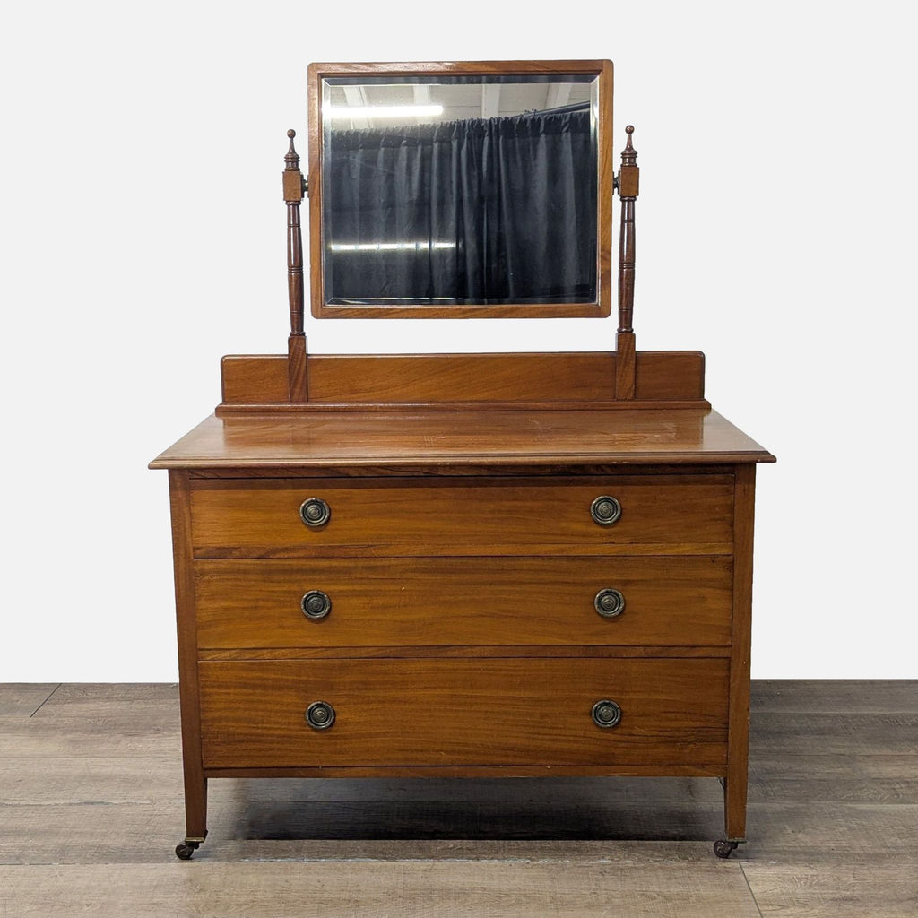 1. Reperch dresser with three dovetail drawers, brass ring pulls, swing mirror, and casters for easy movement.  