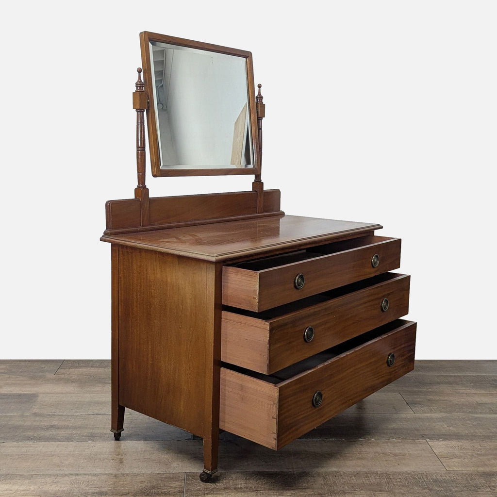 2. Side view of a Reperch dresser, showing all three drawers opened and the adjustable mirror above.  
