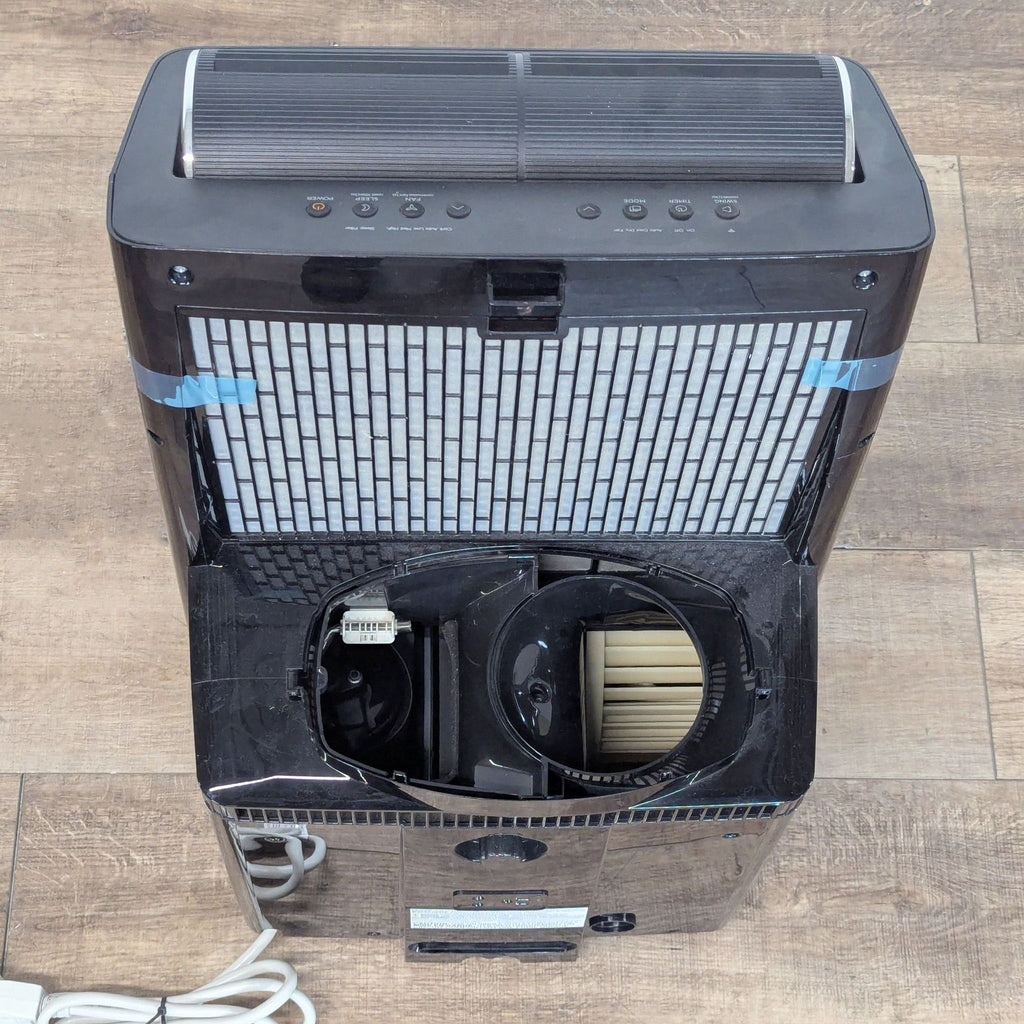 Top-down view of the Midea portable air conditioner’s rear, highlighting the dual hose ports and filter section.
