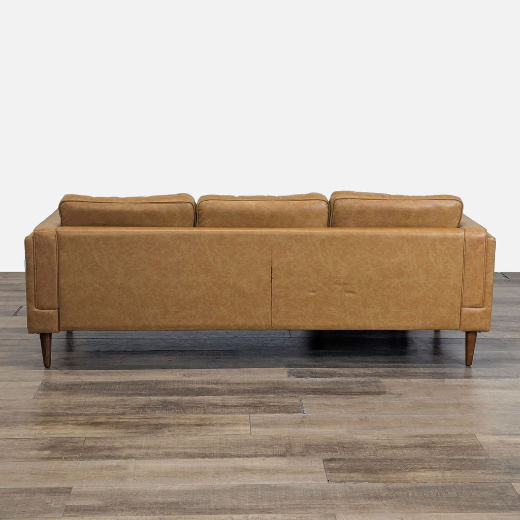 3. Rear view of Albany Park 3-seat sofa in vegan leather upholstery with tapered walnut legs.
