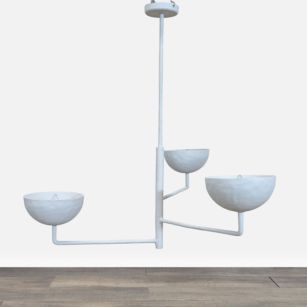 1. Three-tiered white cast metal pendant light with a plaster finish, featuring a sculptural, modern design.  