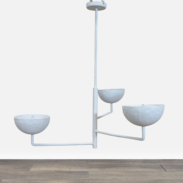 1. Three-tiered white cast metal pendant light with a plaster finish, featuring a sculptural, modern design.  