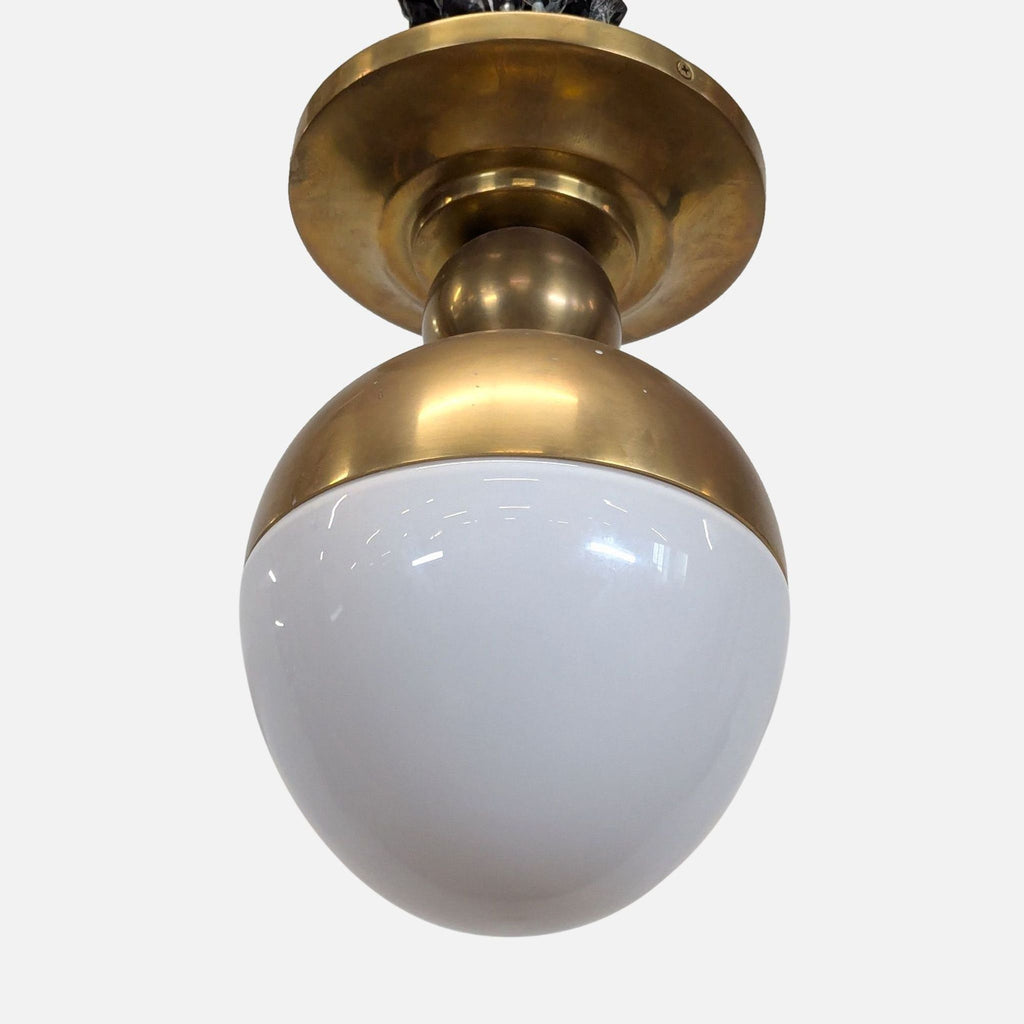 2. Close-up of a dome-shaped antiqued brass and white glass lighting fixture from One Kings Lane.  