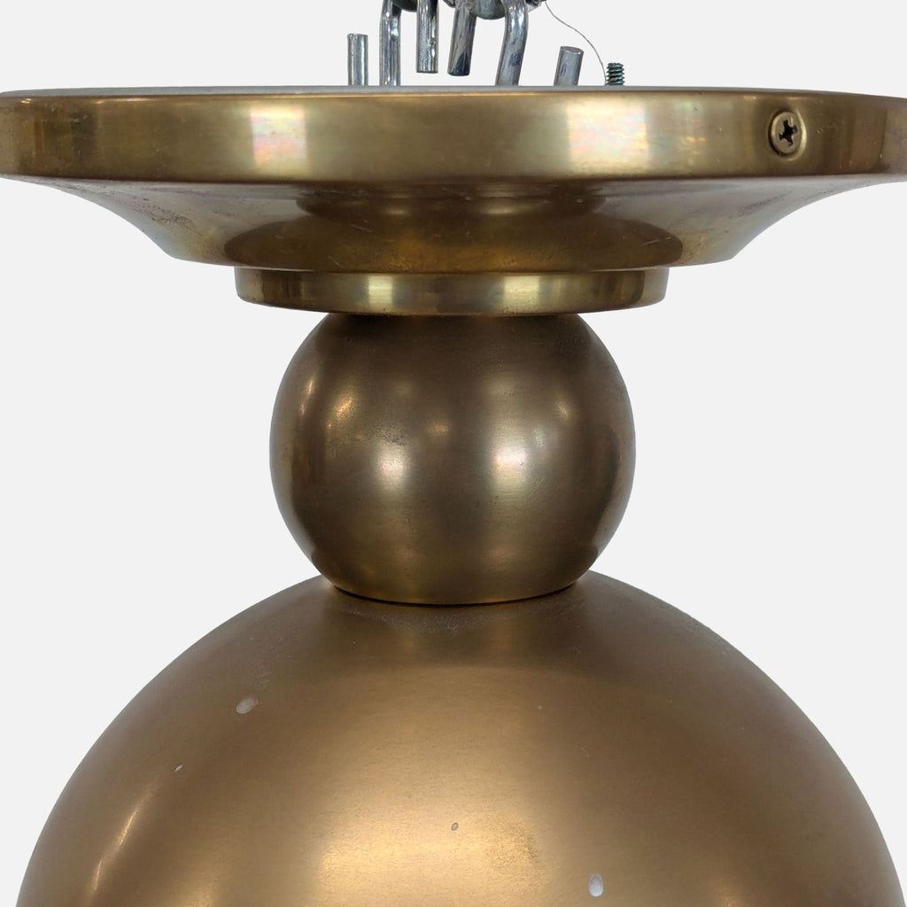 3. Detail view of the antiqued brass base and mounting hardware on a One Kings Lane lighting fixture.