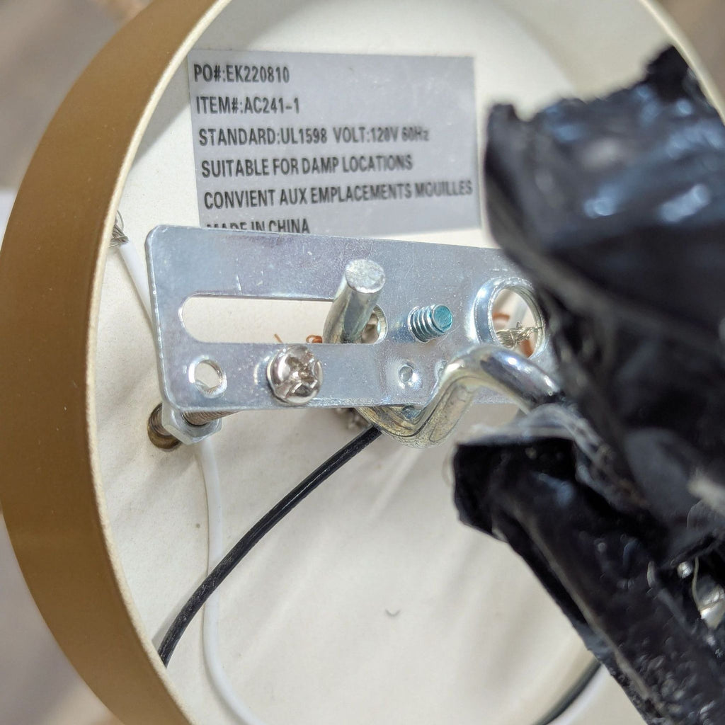 2. Close-up of the gold ceiling mount for Reperch hemp rope light, showing wiring and product label details.