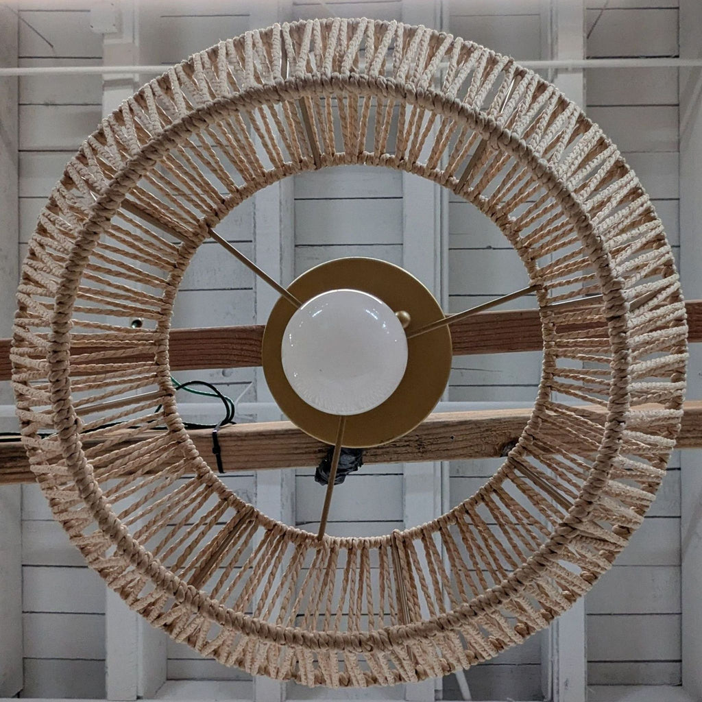 3. Overhead view of Reperch lighting fixture with round hemp rope woven shade and central gold mount.