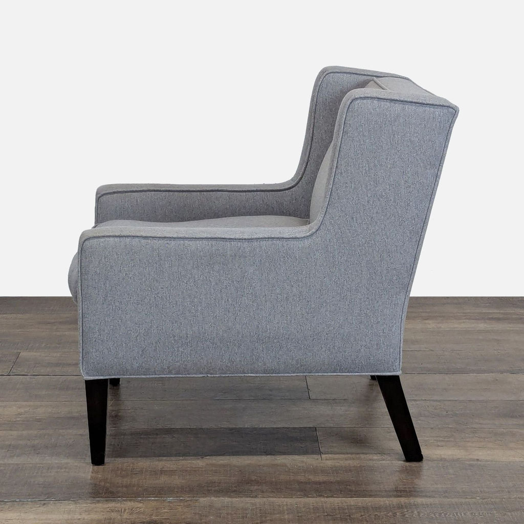3. Another side angle of the Cypress Furniture gray wingback lounge chair with a high back and removable cushion.