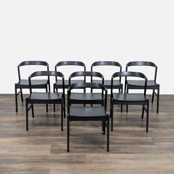 Set of eight black Reperch dining chairs with curved backs, arranged on a wood floor.  