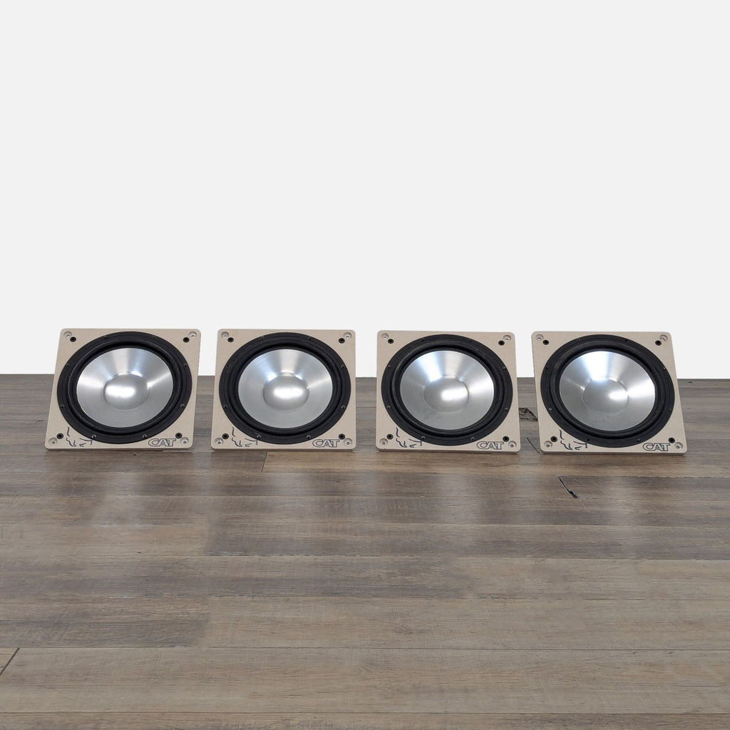Set of four CAT (California Audio Technology) 6.5-inch aluminum cone speaker drivers shown side by side.