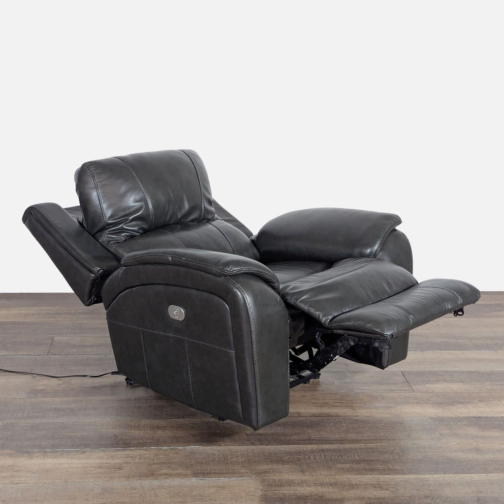Side view of Living Spaces power recliner fully extended with adjustable power headrest, Lounge collection.