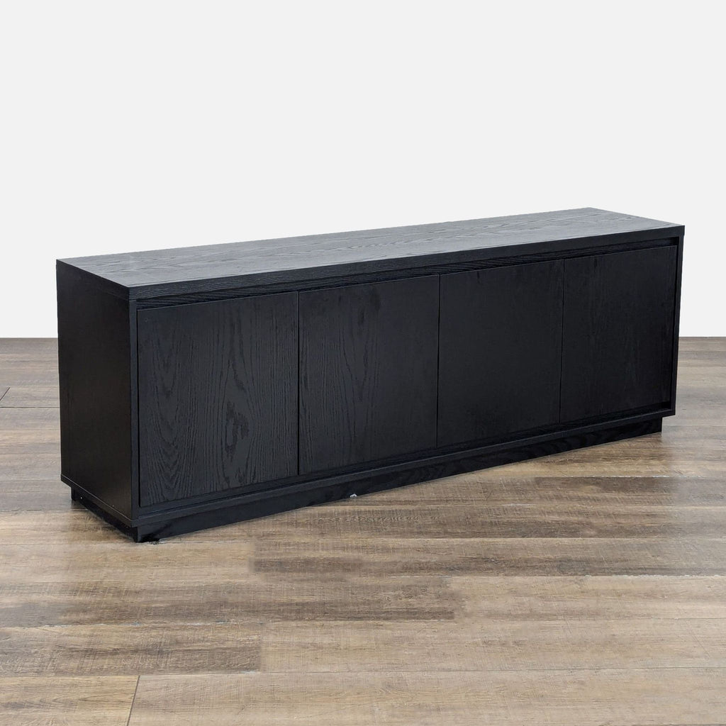 3. Angled view of a sleek black Reperch entertainment console featuring sturdy MDF construction and clean lines.
