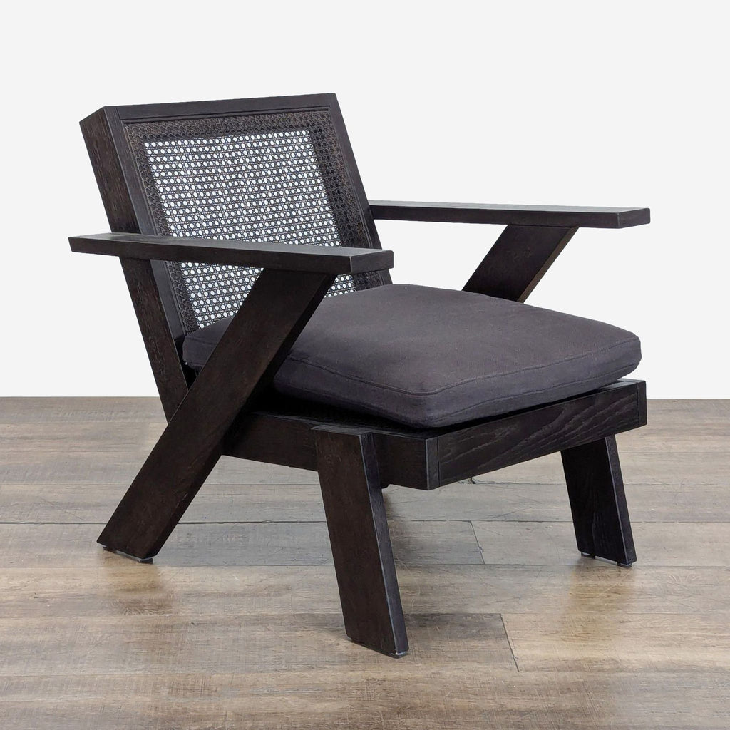 Three-quarter angle of Jeannie Cane Accent Chair featuring cane back, solid oak frame, and plush charcoal seat.