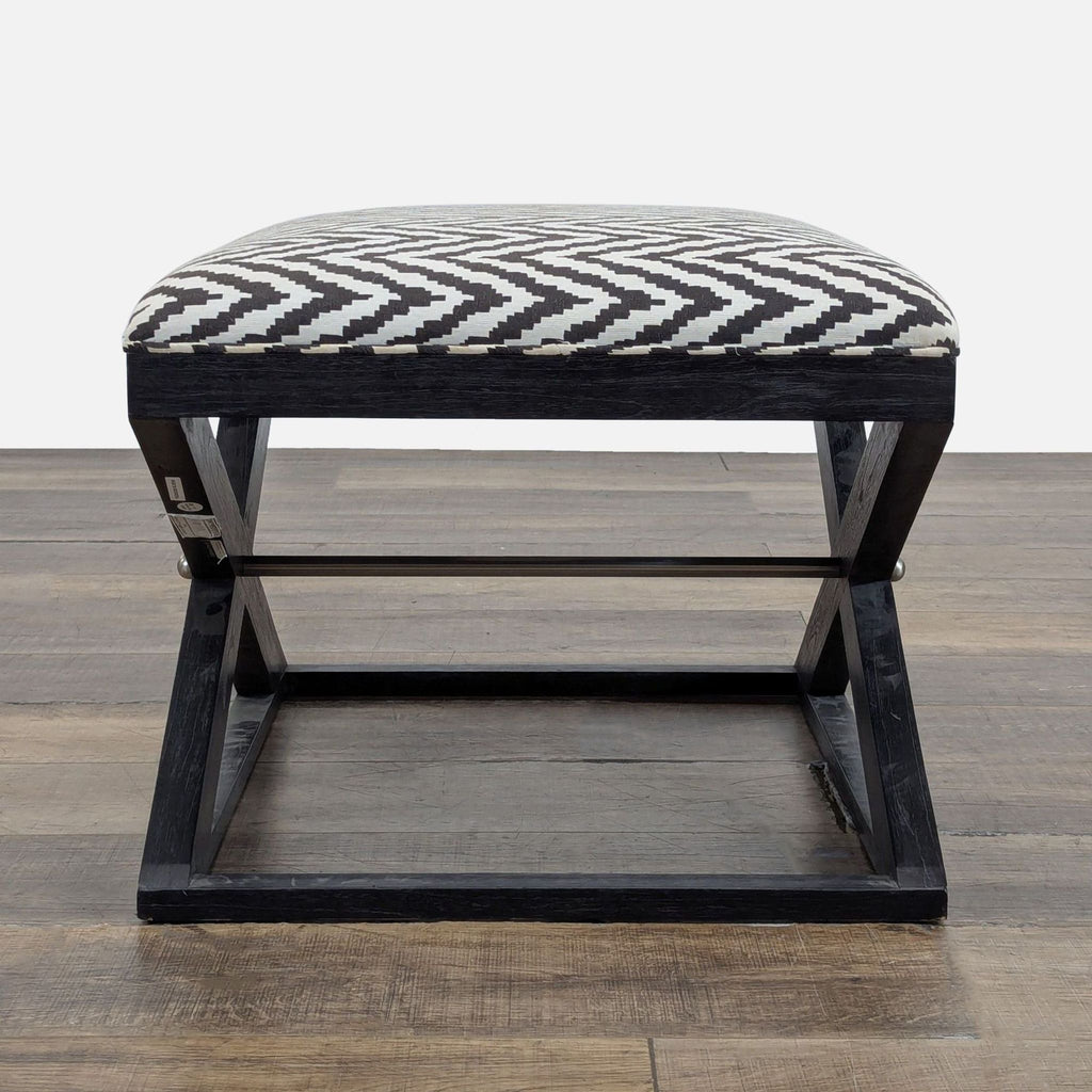 3. Chevron fabric ottoman on crossed wood frame, viewed from the front, designed by Brownstone Furniture.