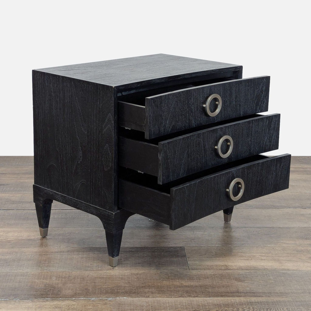 2. Side angle of Brownstone end table showing three open drawers, solid teak build in deep onyx finish.