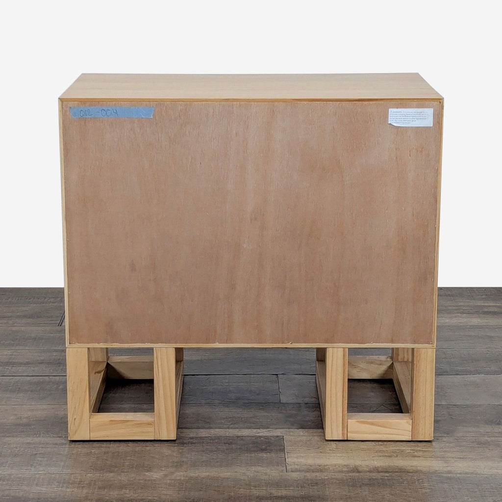 3. Back view of Reperch cabinet, plain wood panel and open square legs, in the Cabinet category.