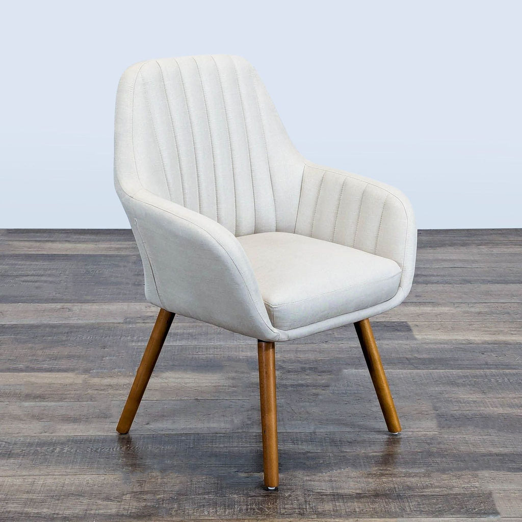 Angled view of a Roundhill Furniture lounge chair with channel-tufted fabric upholstery and wooden legs.