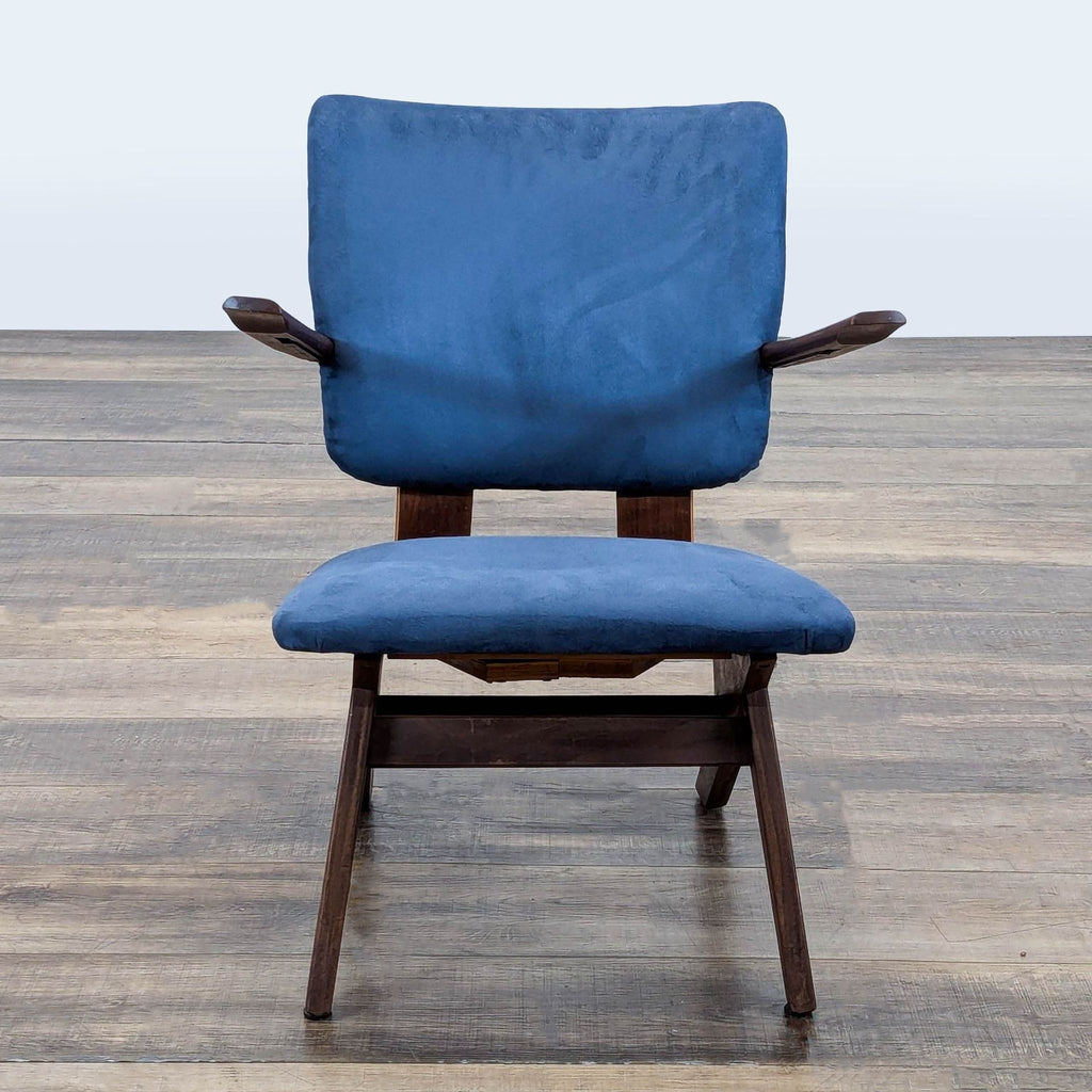 1. Front view of a mid-century modern lounge chair by Reperch with blue cushions and a dark wood angled frame.  