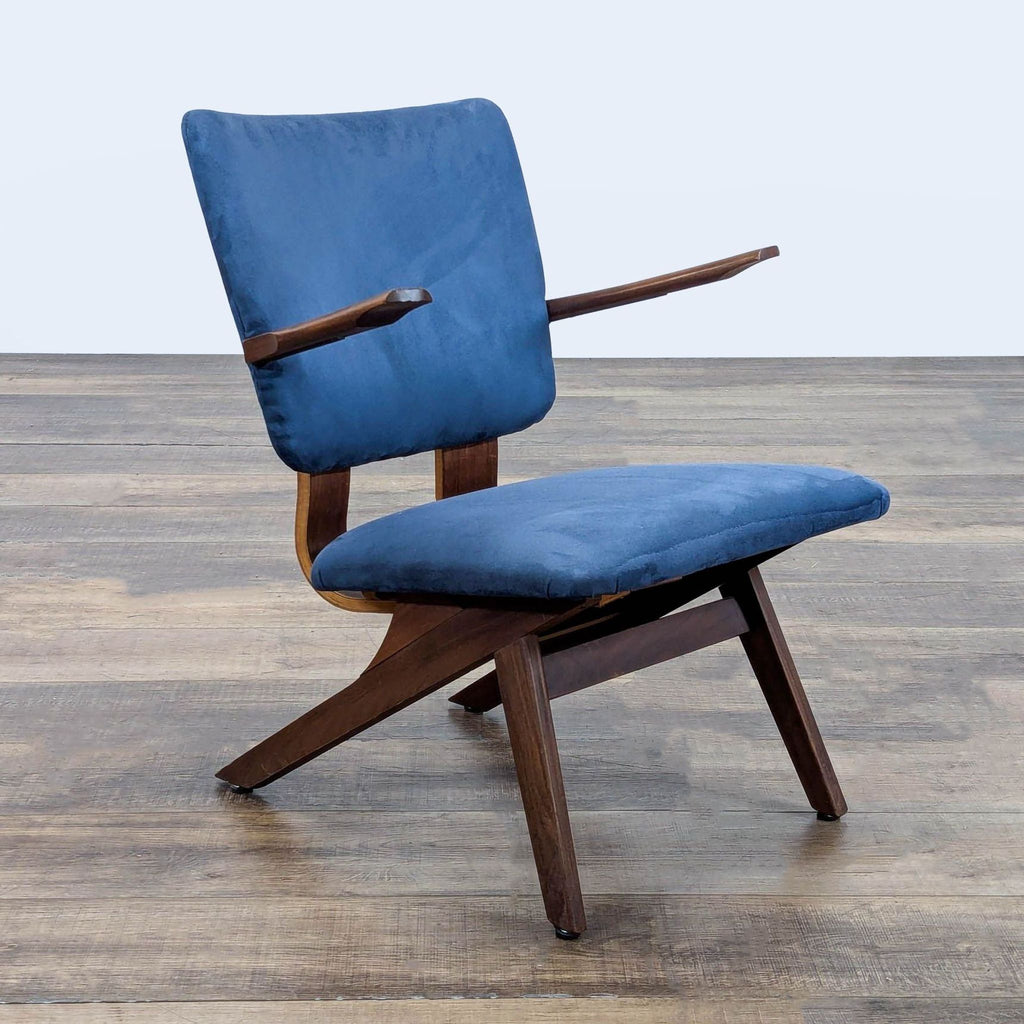 3. Angled view of a Reperch lounge chair, displaying clean lines, blue upholstery, and dark wood mid-century frame.