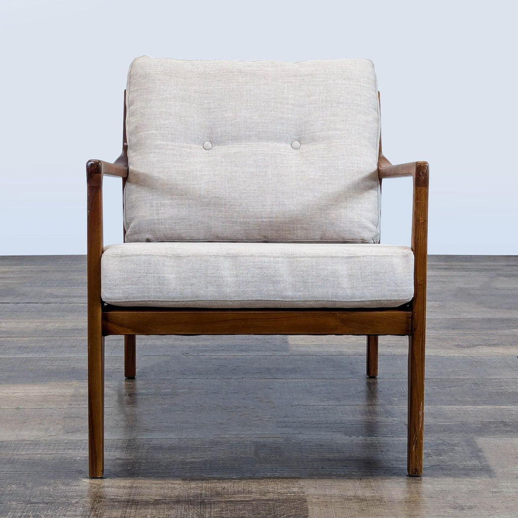 1. Front view of a Reperch lounge chair with solid wood frame, slatted back, and upholstered cushions.