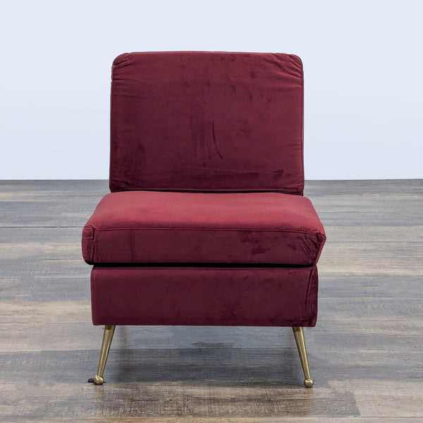 Front view of MXM lounge chair with garnet velvet upholstery and gold tone metal legs.  