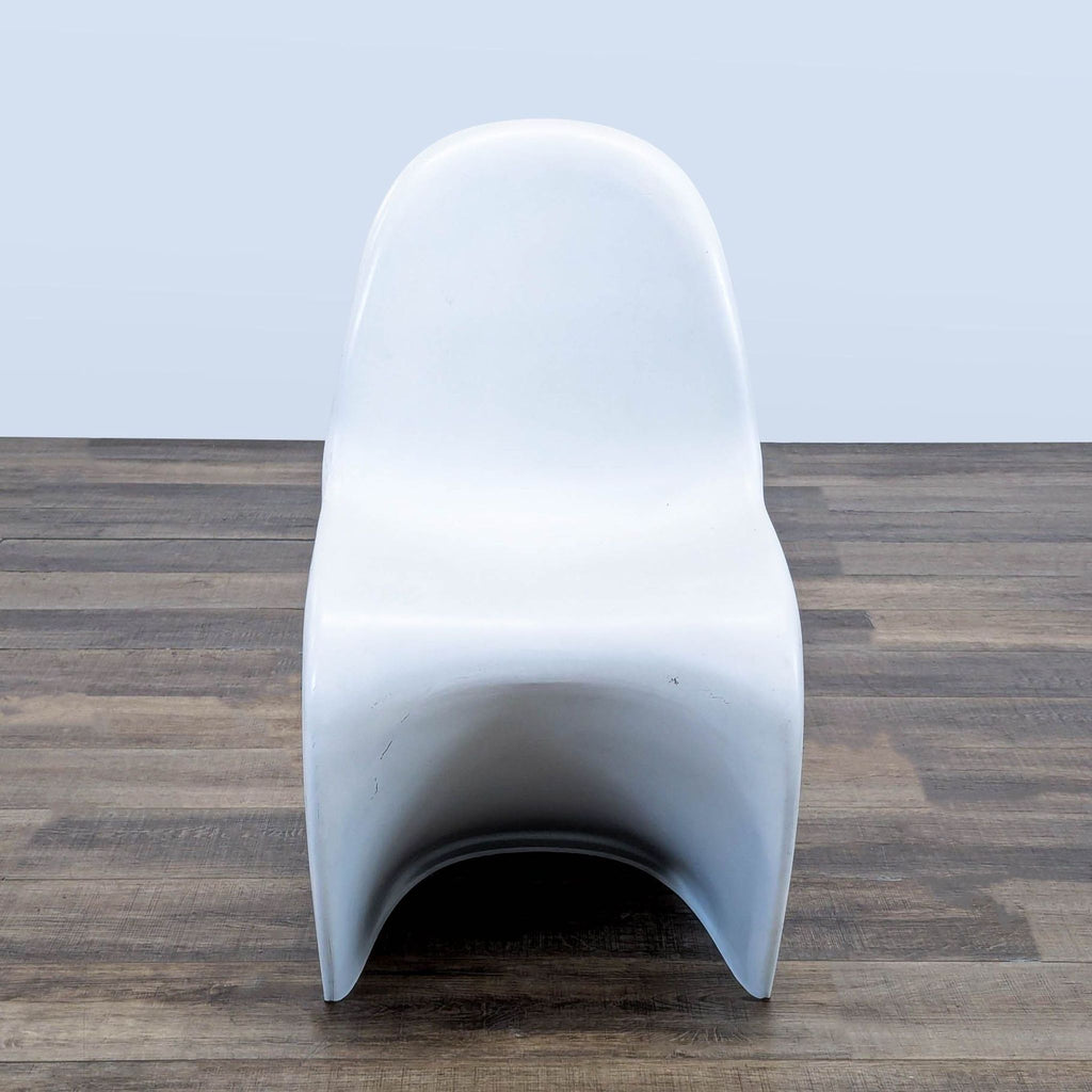 Front view of the iconic Reperch Panton Chair, a modern dining chair with smooth, curved plastic form.  