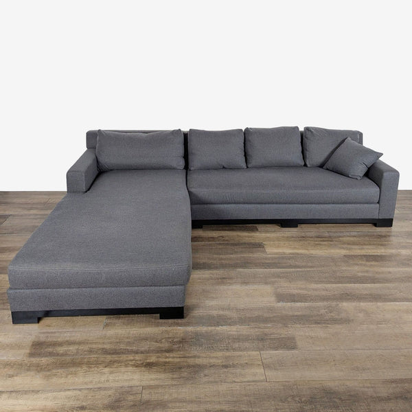 1. Gray L-shaped Fitzgerald sectional sofa with chaise lounge, shown from the front on wooden flooring.