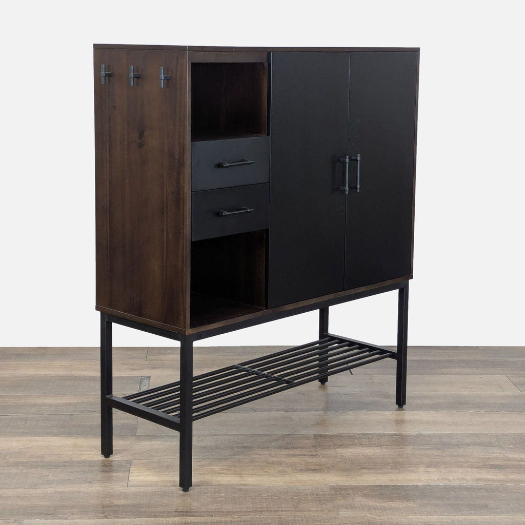 3. Side angle of stylish Crate & Barrel cabinet with six hooks, two drawers, cubbies, and black metal shelf base.