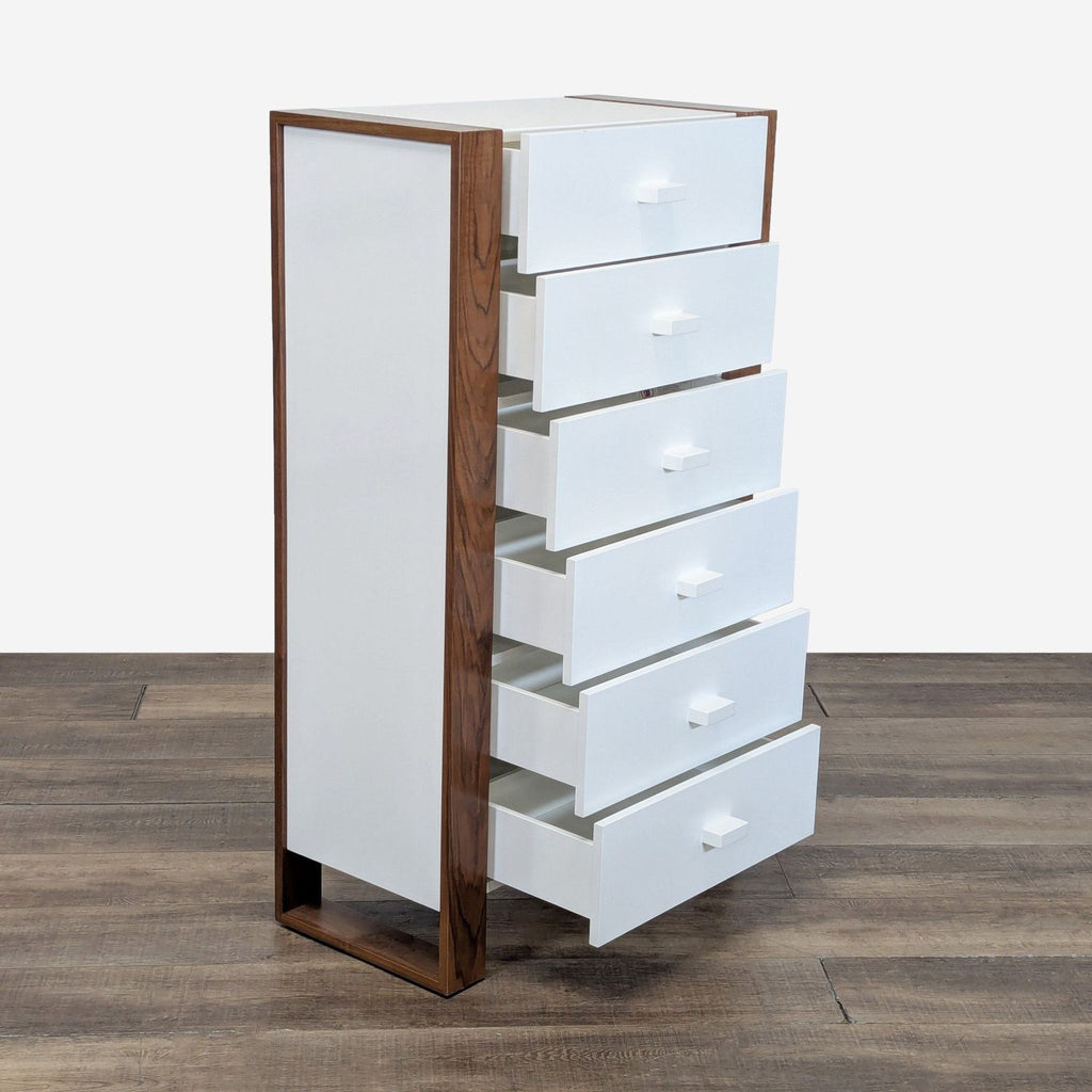 2. Six-drawer chest by Ducduc, featuring a white front, wood sides, and open drawers, angled side view.  