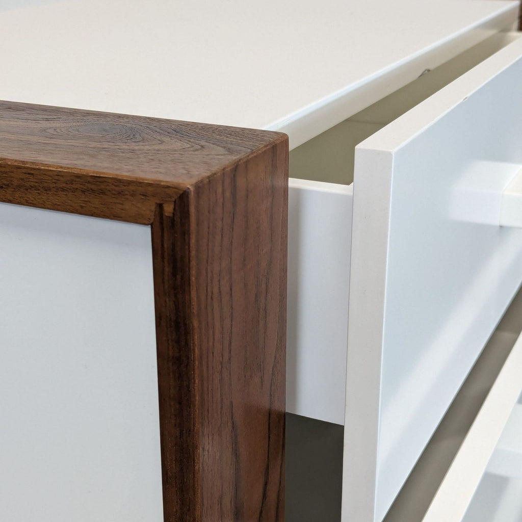 3. Close-up of the Ducduc dresser showing wood grain finish and white drawer with a rectangular pull.