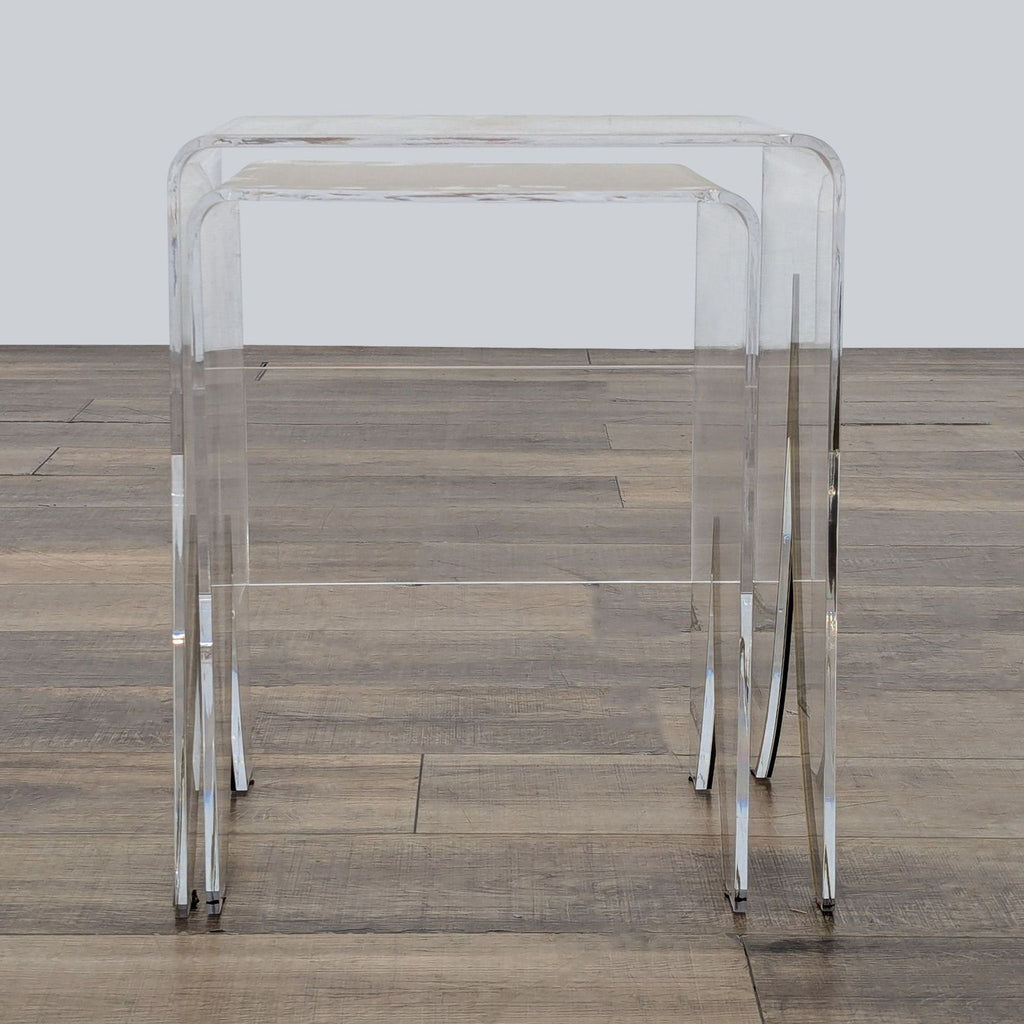 2. Nesting acrylic end tables with brass inlay from Gabby Magnolia, featuring a modern waterfall silhouette.