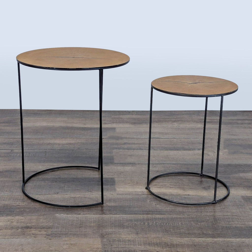 3. Reperch side tables featuring minimalist black metal frames and round wooden tops, arranged slightly apart.