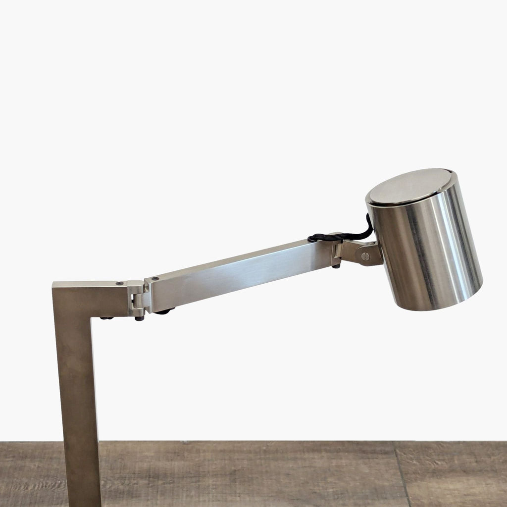 Modern adjustable-arm floor lamp in chrome finish from Christian Liaigre, Lighting category.