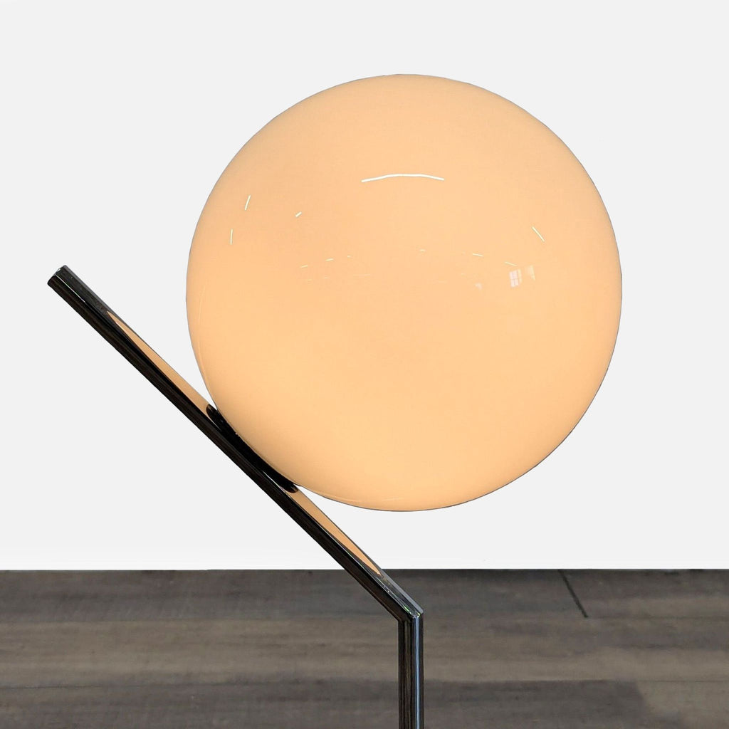 2. Close-up of the opal glass diffuser on the chromed steel lamp by Michael Anastassiades, lighting category.  