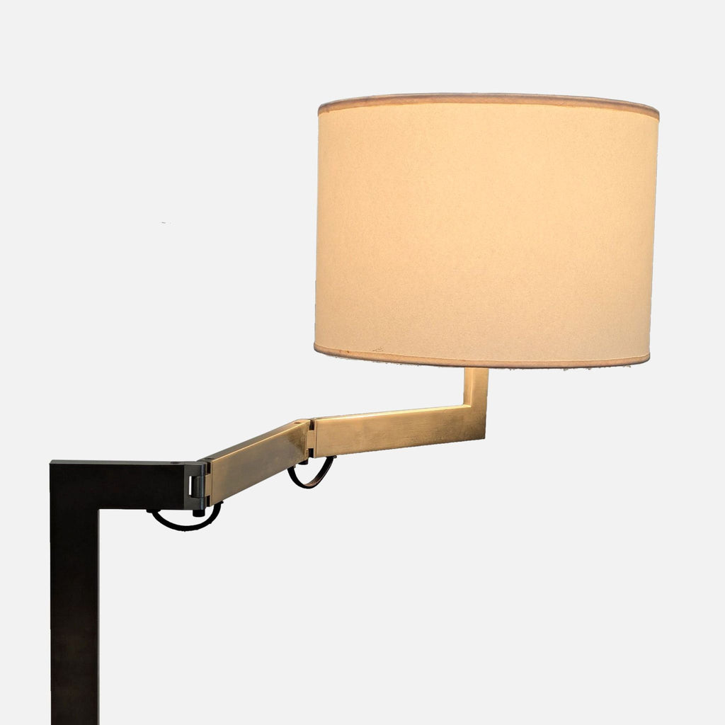 2. Close-up of Reperch lamp's adjustable metal arm and cylindrical fabric shade, emphasizing modern lighting detail.