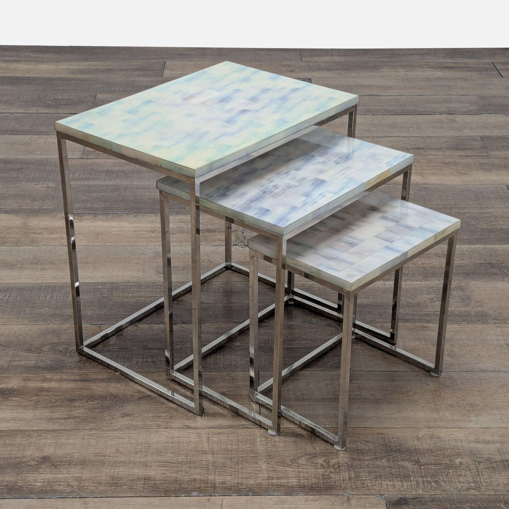 2. Trio of rectangular HD Buttercup end tables with marble-like tops and silver metal legs, partially stacked.