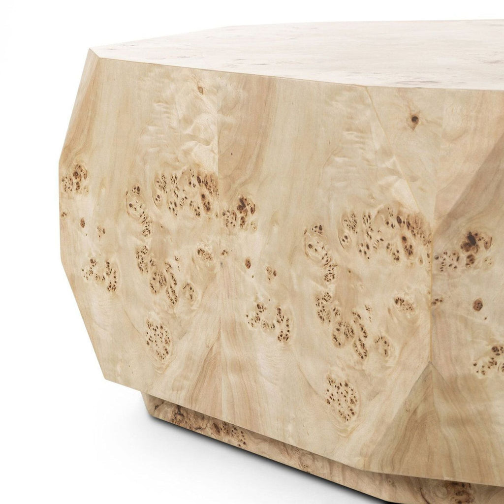 2. Close-up of the faceted side and detailed poplar burl veneer pattern on the Reperch coffee table.