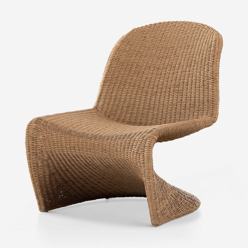 Angled view of a Lulu and Georgia chair, featuring smooth wicker weaving and a contoured scoop seat.