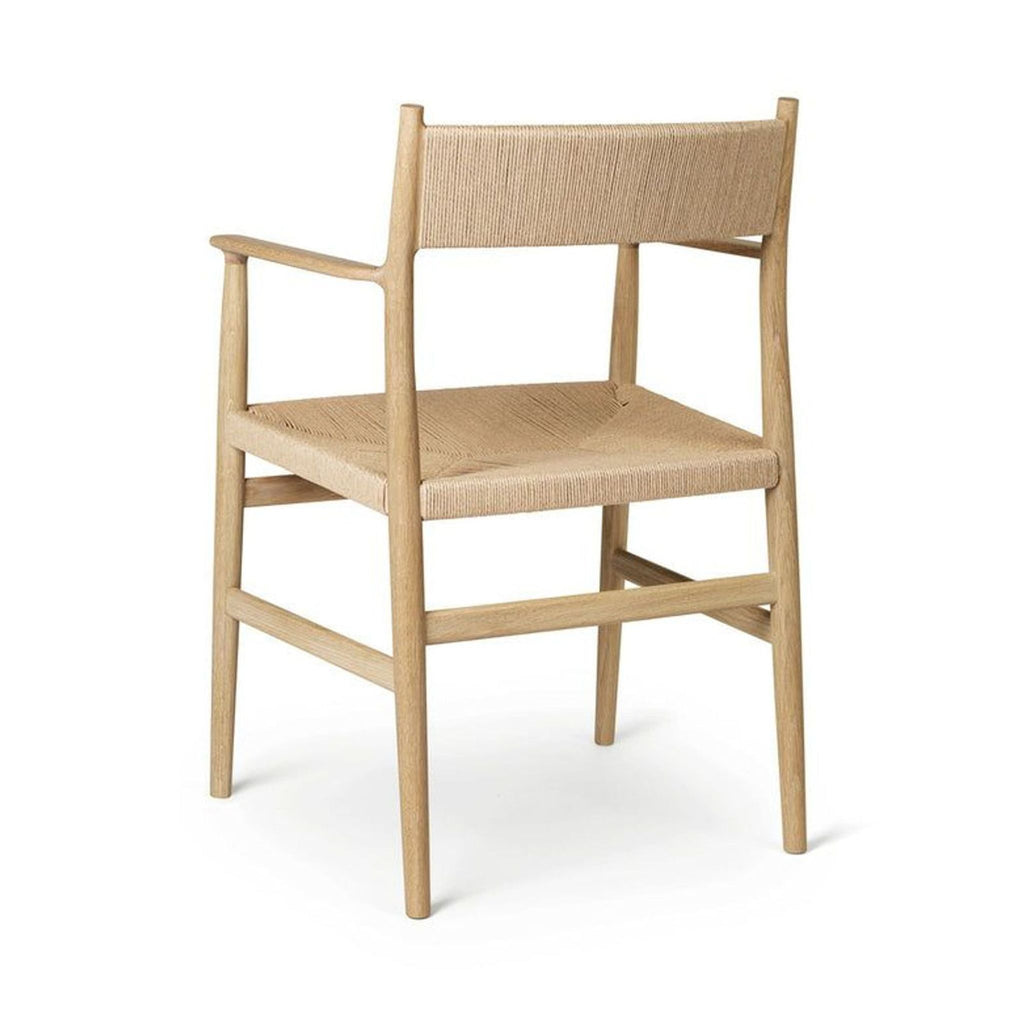 3. Rear angle of the Arv oak dining chair, showing the contoured backrest and detailed hand-woven seat.