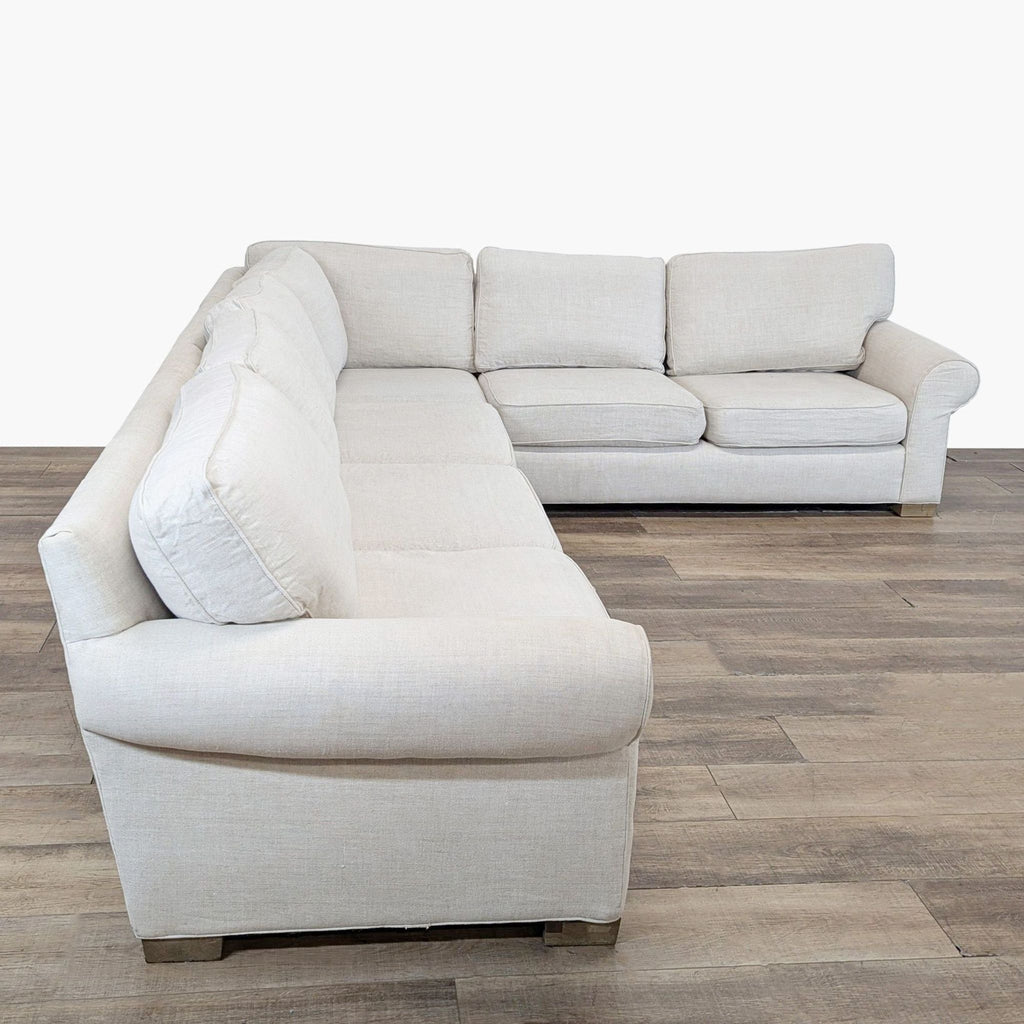 2. Side angle of a Restoration Hardware sectional sofa featuring plush seats, rolled arms, and washable covers.