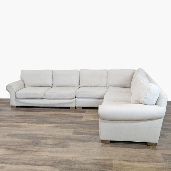 1. Restoration Hardware Ocular sectional with rolled arms, welted trim, and washable cushion covers on wood flooring.