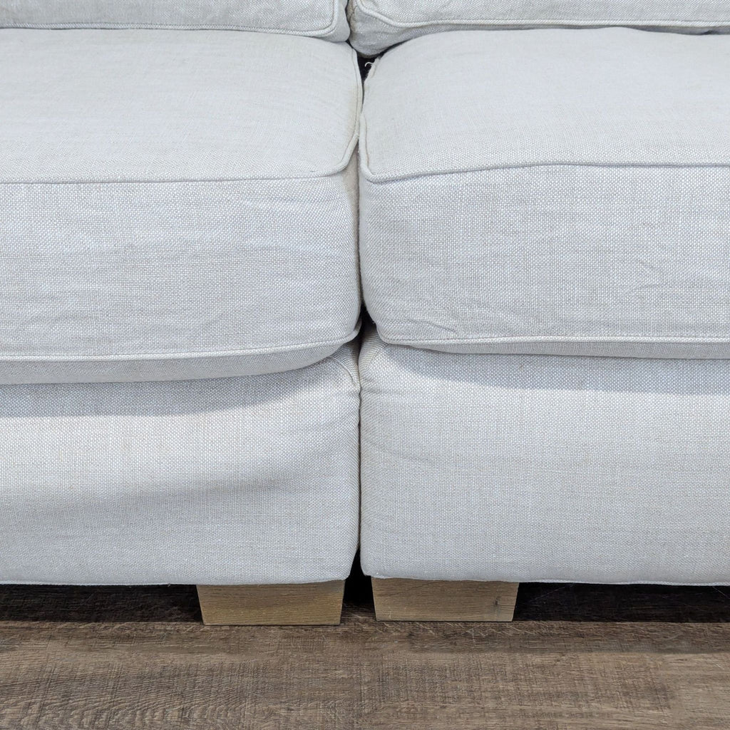 3. Close-up of the Restoration Hardware sectional showing welted cushion trim and textured, washable fabric.
