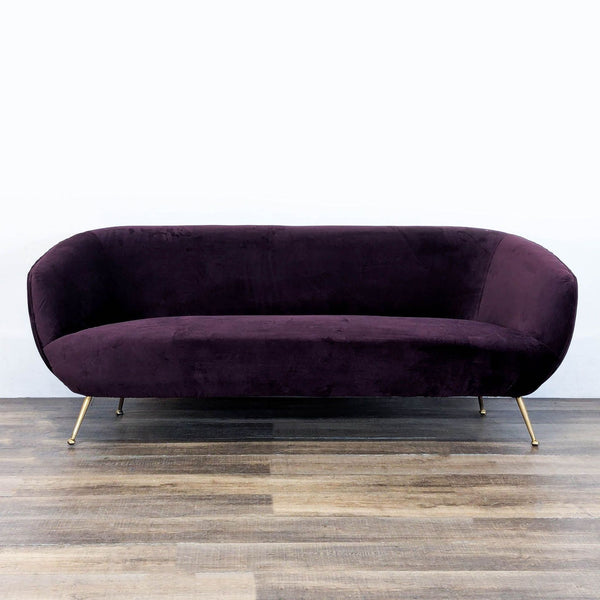 1. Reperch 3-seat sofa with rounded shape, pleated velvet upholstery, and sleek gold pin legs, front view.  